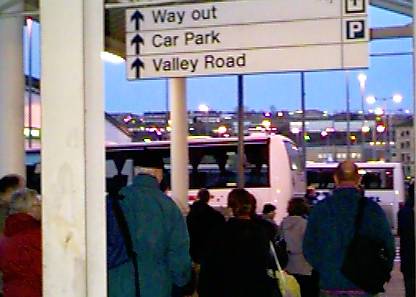 [Weary train passengers at Bradford head for the busses]